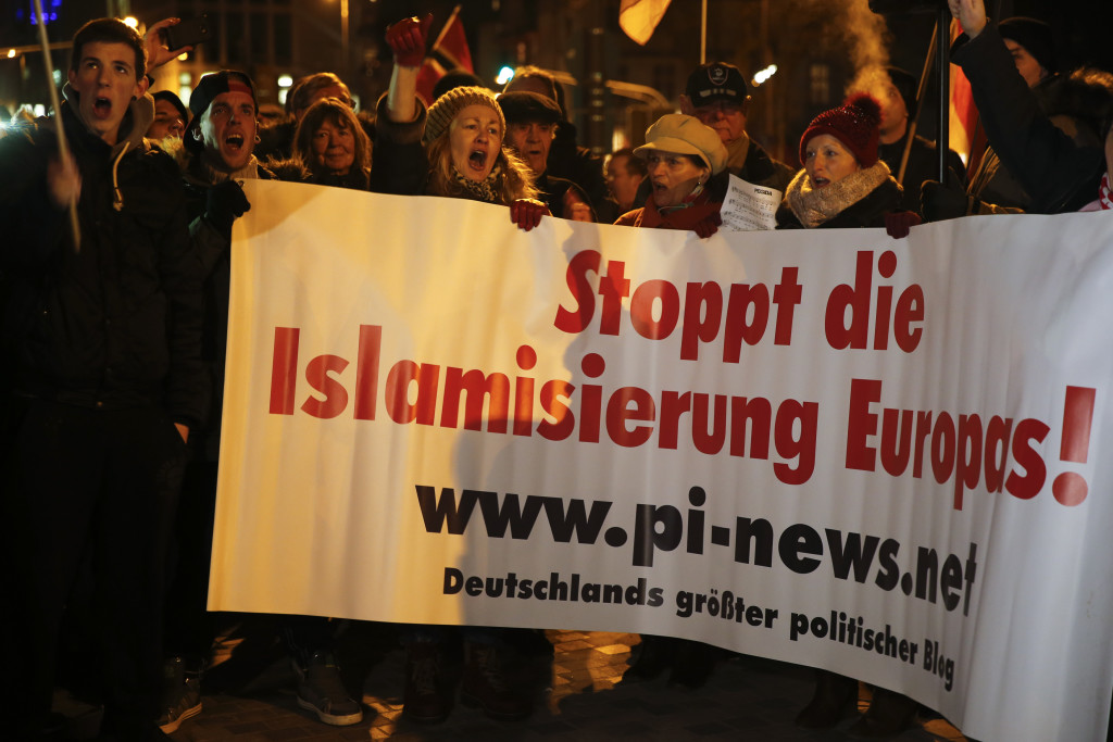 People take part in a march of a grass-roots anti-Muslim movement in Cologne