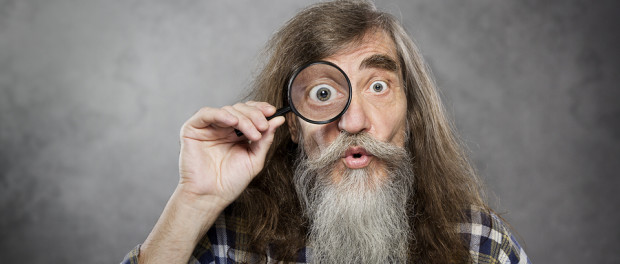 Senior Old Man Looking Through Zoom Magnifying Glass. Funny Elde
