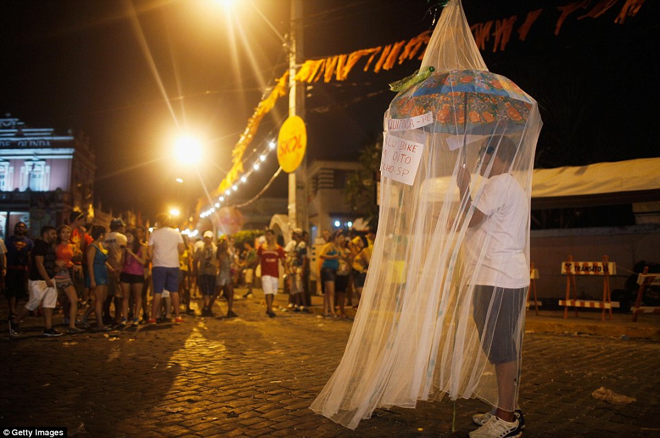 30F39AC500000578-3435862-Done_with_a_laugh_A_reveller_stands_beneath_a_mosquito_net_as_a_-a-95_1454847008182