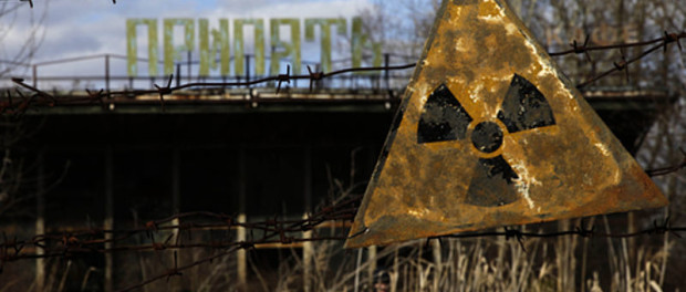 A radioactive sign hangs on barbed wire outside a café in Pripyat.