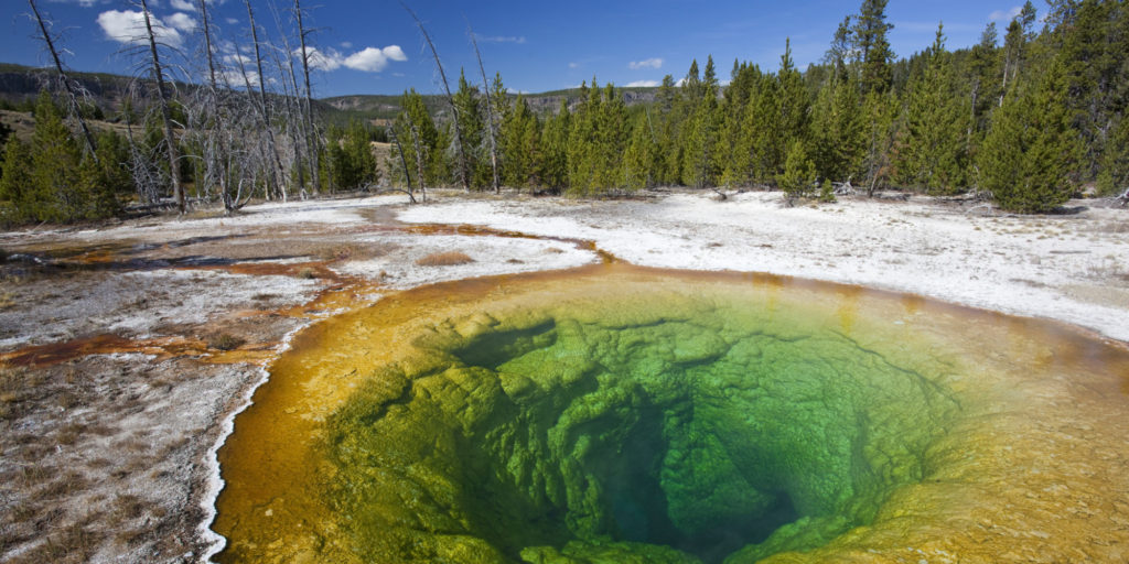 Rock formations and colorful pool