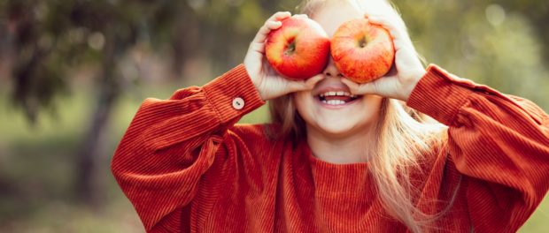 Portrait,Of,Girl,Eating,Red,Organic,Apple,Outdoor.,Harvest,Concept.